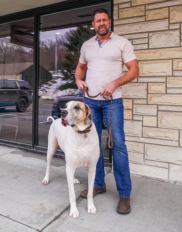 Top Omaha Chiropractor Dr. Jamie Van Roekel and his dog Joey
